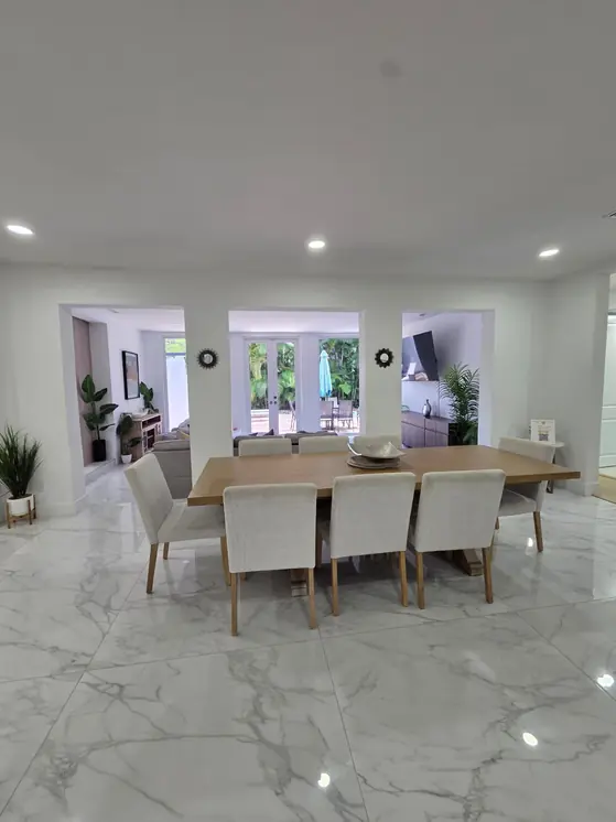 Bright dining area with white marble floors, cleaned by AYA Nova